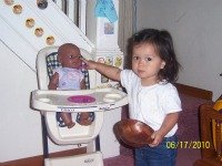 Bella playing with doll