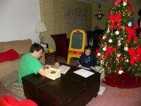 nick and maya playing school at Christmas time